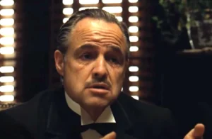 Leia mais sobre o artigo O Estúdio Disse Não, Brando Encheu a Boca de Algodão e Inventou o Don Corleone: Os Bastidores de O Poderoso Chefão Que Ninguém Te Contou
